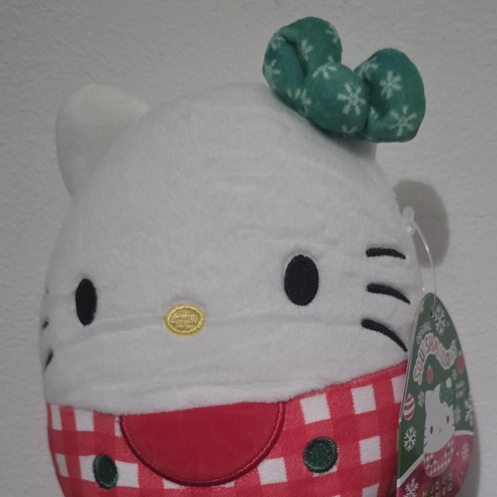 Hello Kitty Christmas plush with red and white checkered scarf and green bow wit